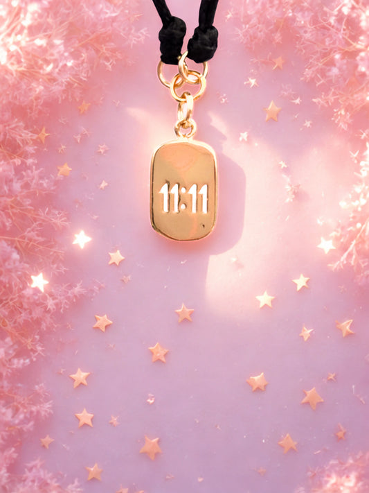 Gold 1111 charm on a black cord bracelet