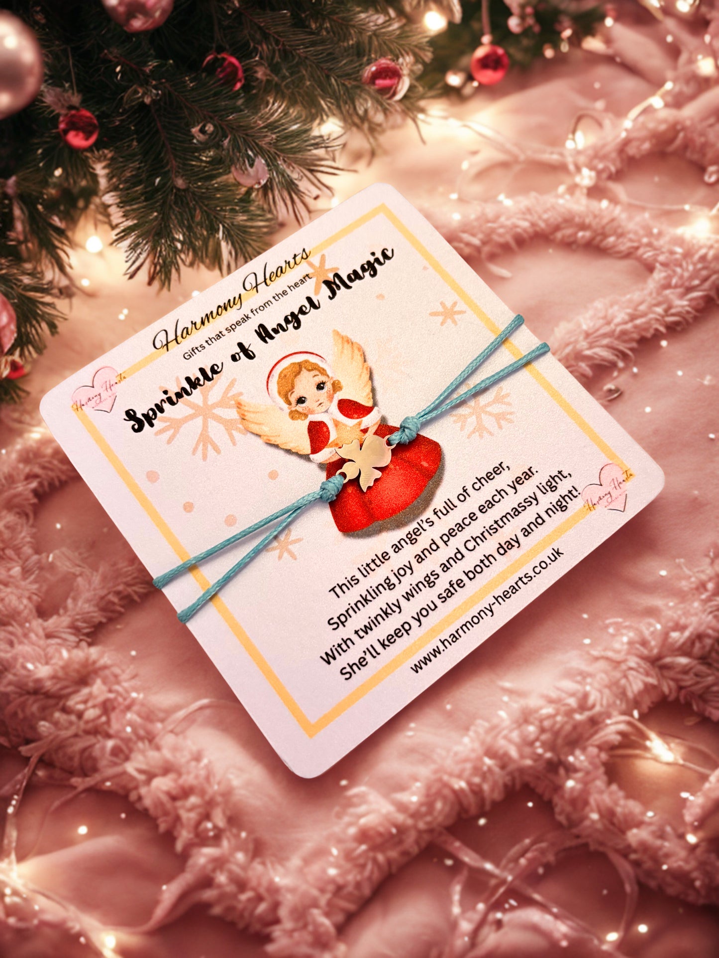 Bracelet on a card with angel illustration and text on a festive background