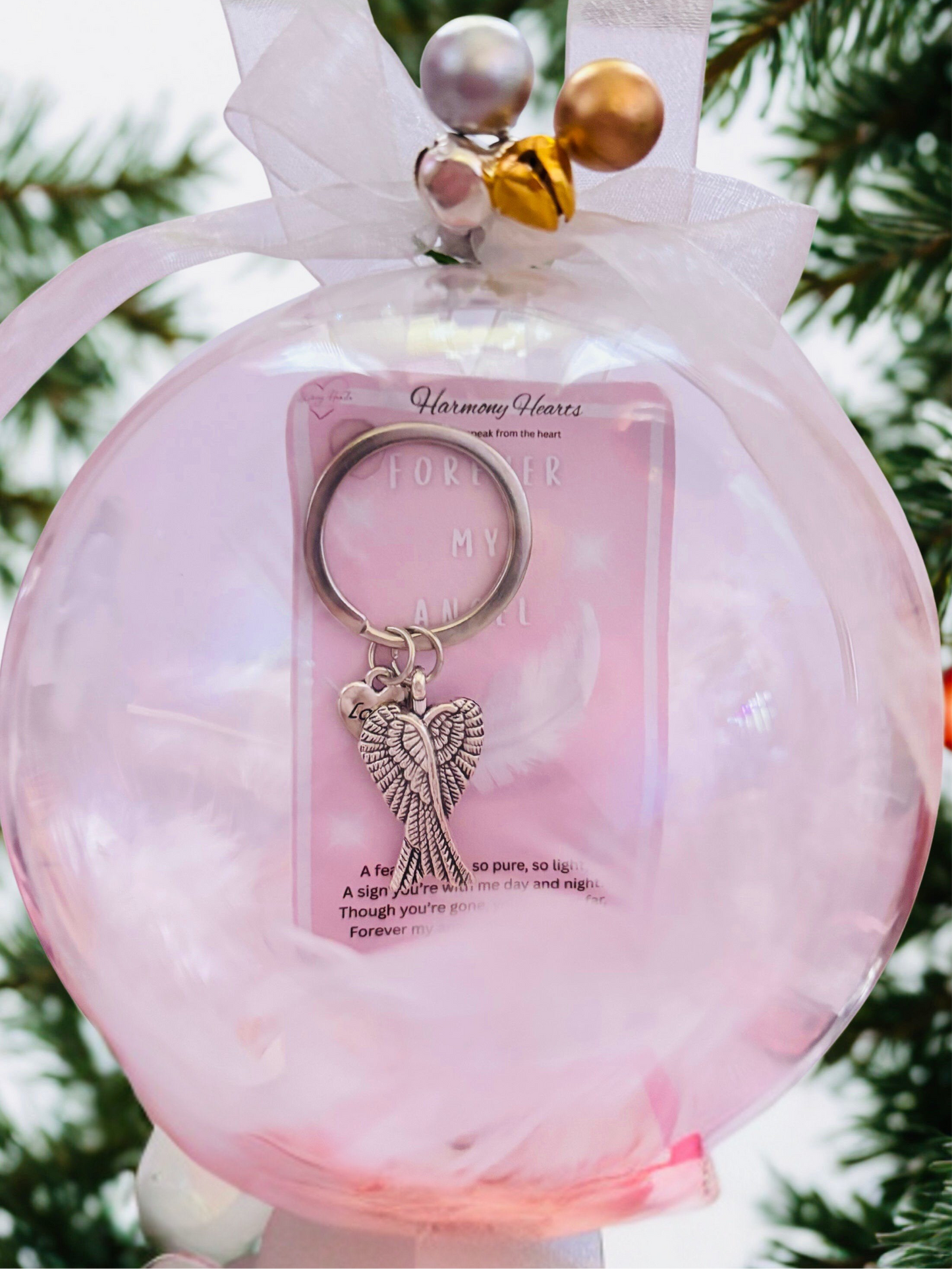 Clear Christmas bauble with an angels wings keepsake inside
