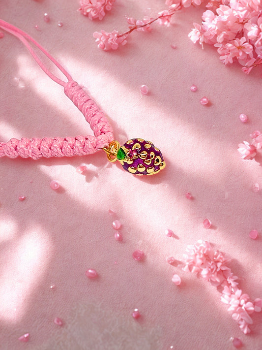 Pink cord bracelet with a blackberry charm