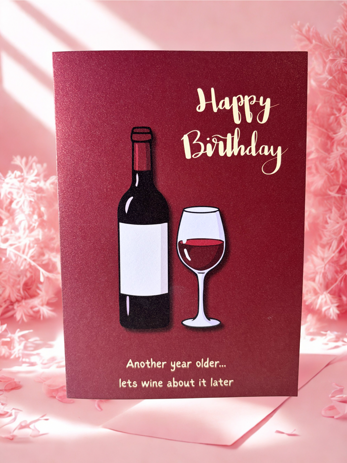 Birthday card with wine bottle and glass illustration on a pink background