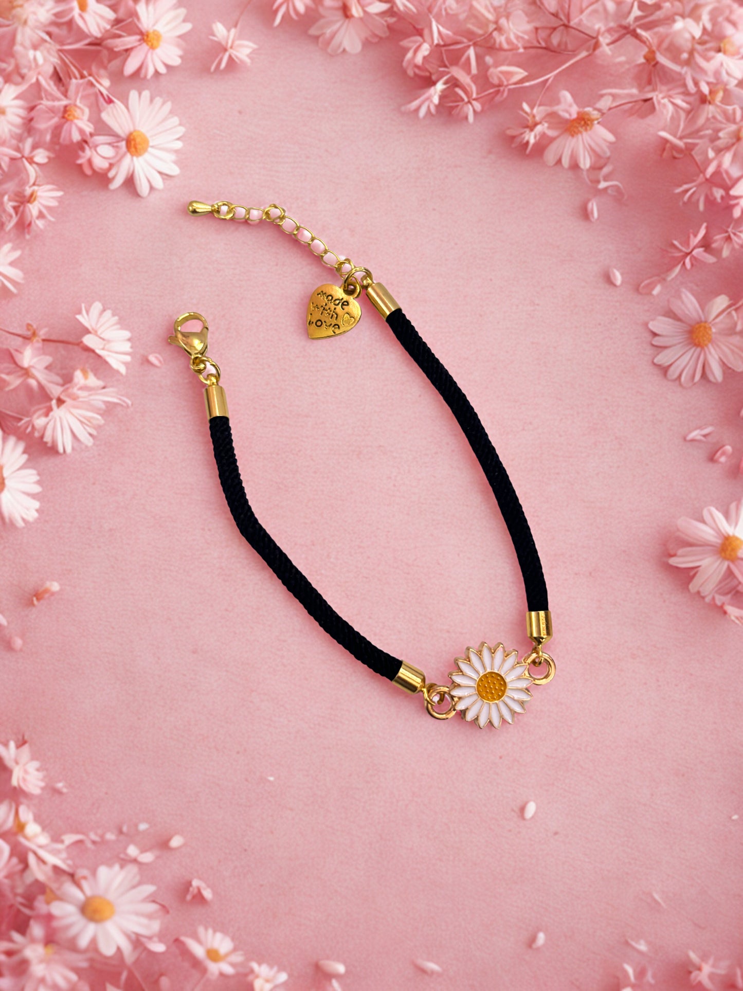 Bracelet with floral pendants on a pink floral background