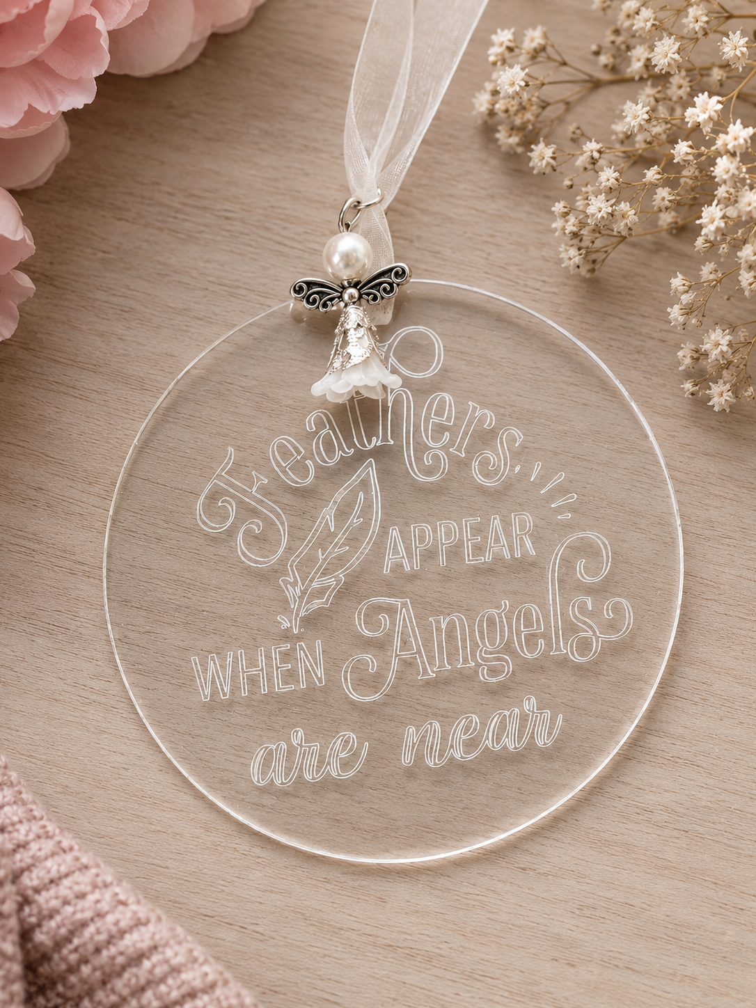 Clear acrylic plaque engraved with the words Feathers appear when angels are near on a decorative ribbon with charm