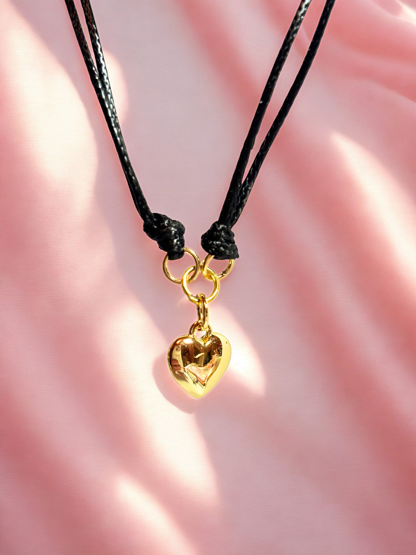 Black cord with gold heart charm bracelet