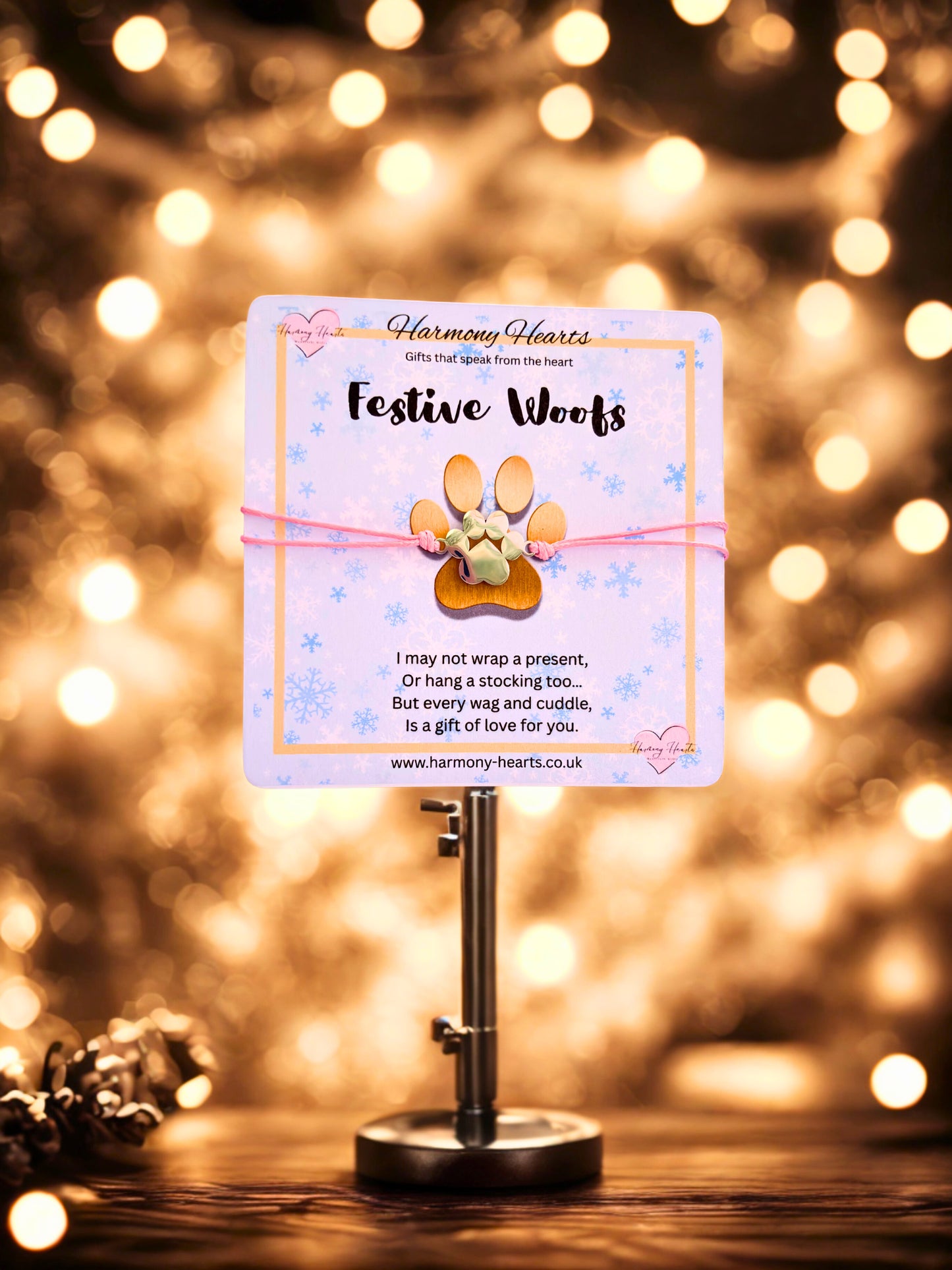 Decorative card on a stand with festive lights in the background