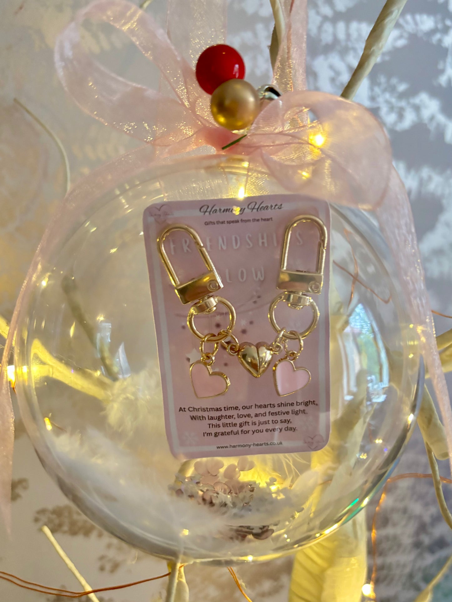 Clear Christmas bauble with heart charms inside