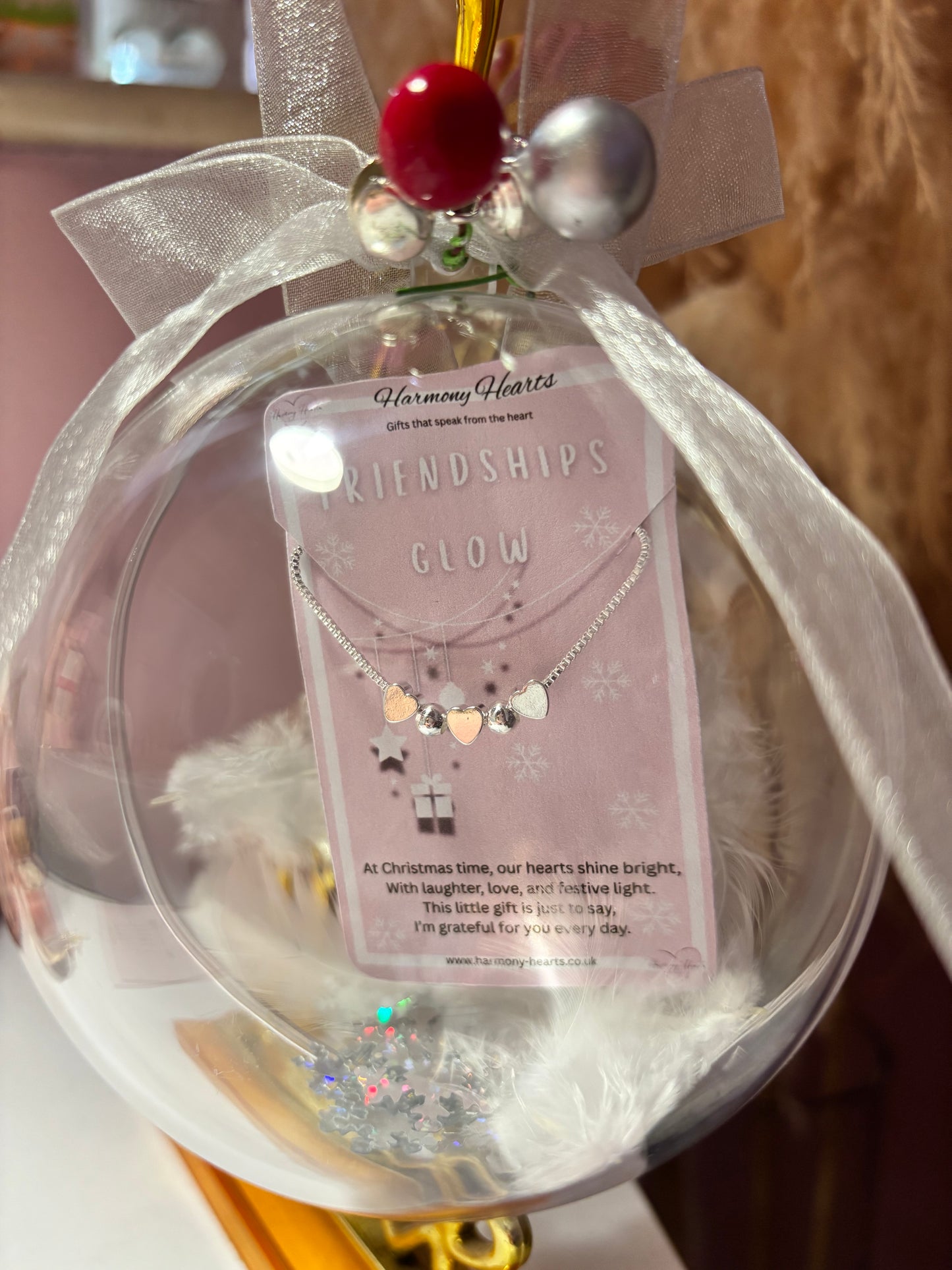 Clear Christmas bauble with silver bracelet inside