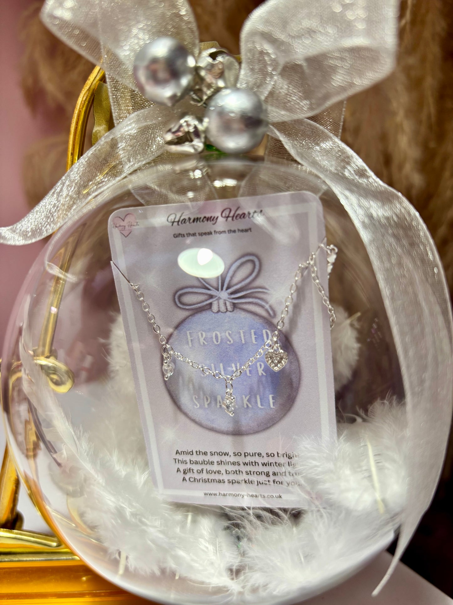 Clear Chrisrmas bauble with a bracelet inside