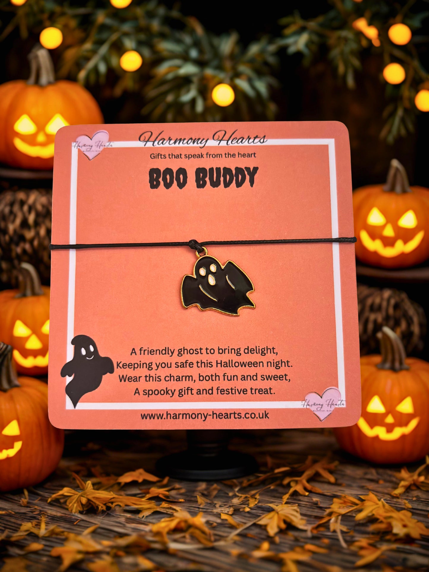 Halloween-themed product packaging with pumpkins and ghost illustrations on a dark background.