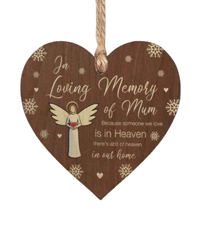 Wooden heart-shaped plaque with an angel illustration and text in memory of a loved one.