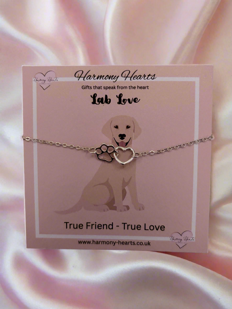Dog-themed bracelet on a pink card with 'Harmony Hearts' branding