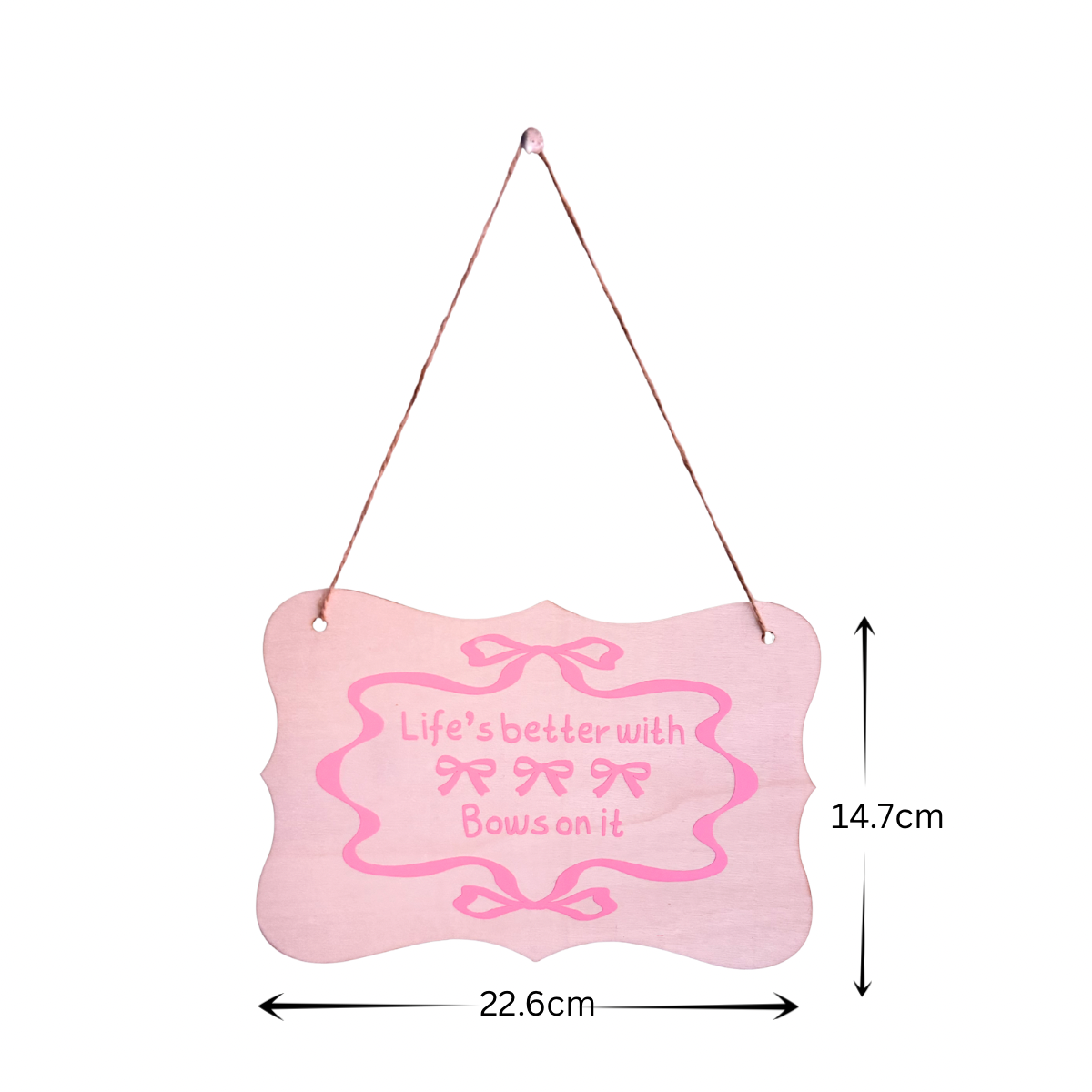 Pink hanging sign with decorative bows and text on a white background