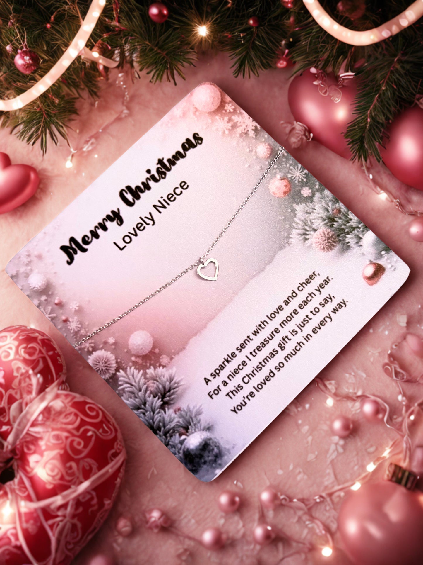 Silver heart bracelet on a Christmas card with lovely niece and decorative elements on a festive background