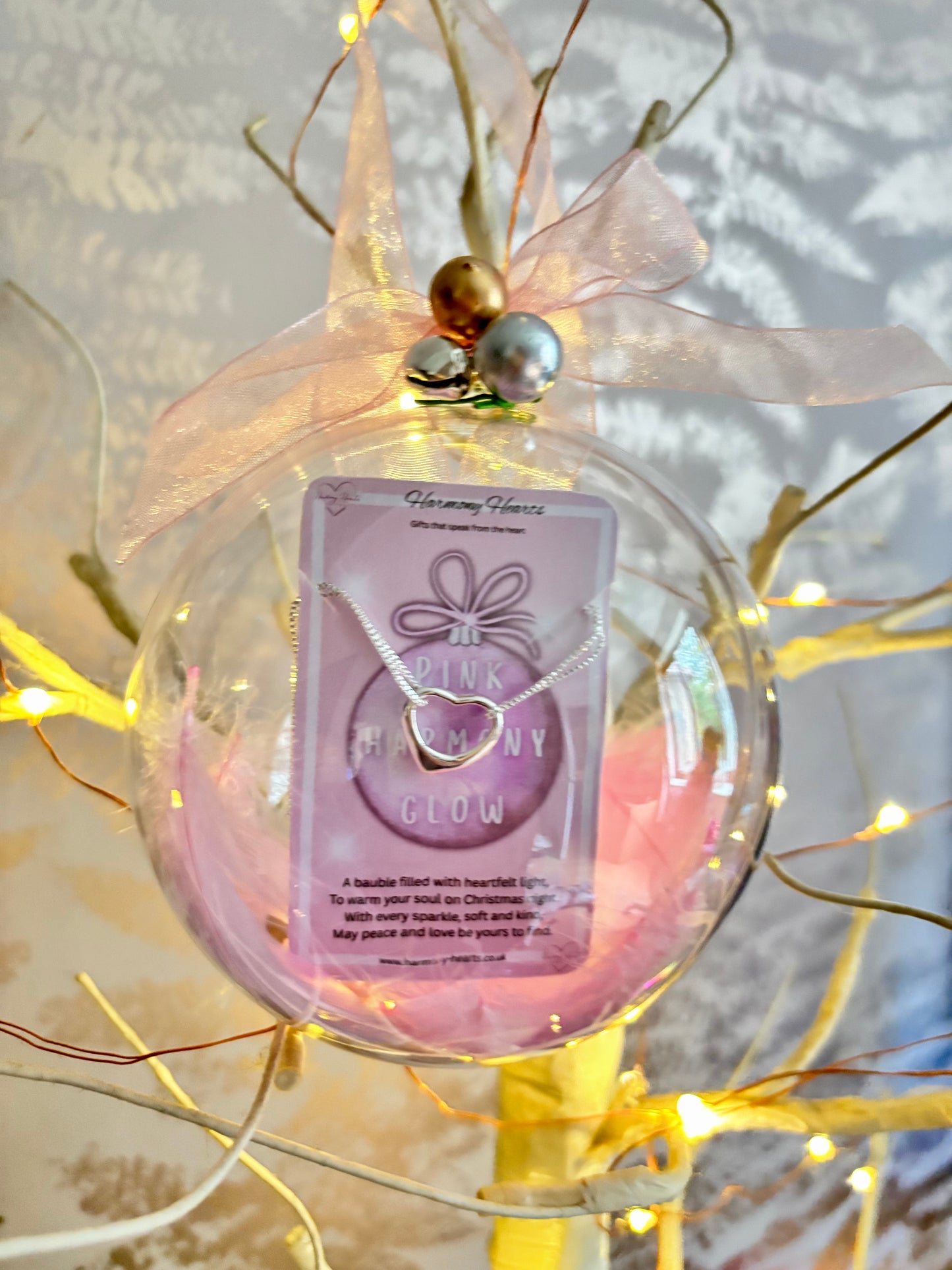 Clear christmas bauble with a bracelet inside