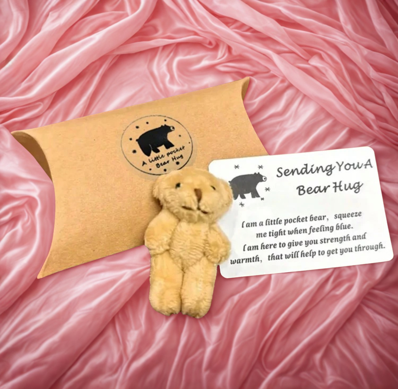 Small pocket bear with a message card on a pink fabric background