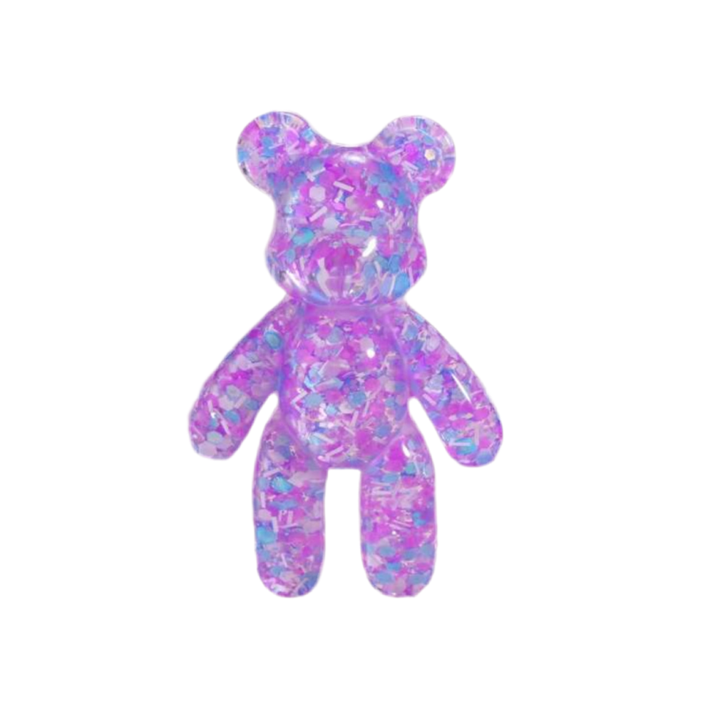 A purple, handcrafted resin bear with shimmer details, designed to be pocket-sized. It has big ears and is described as having a heart full of love.
