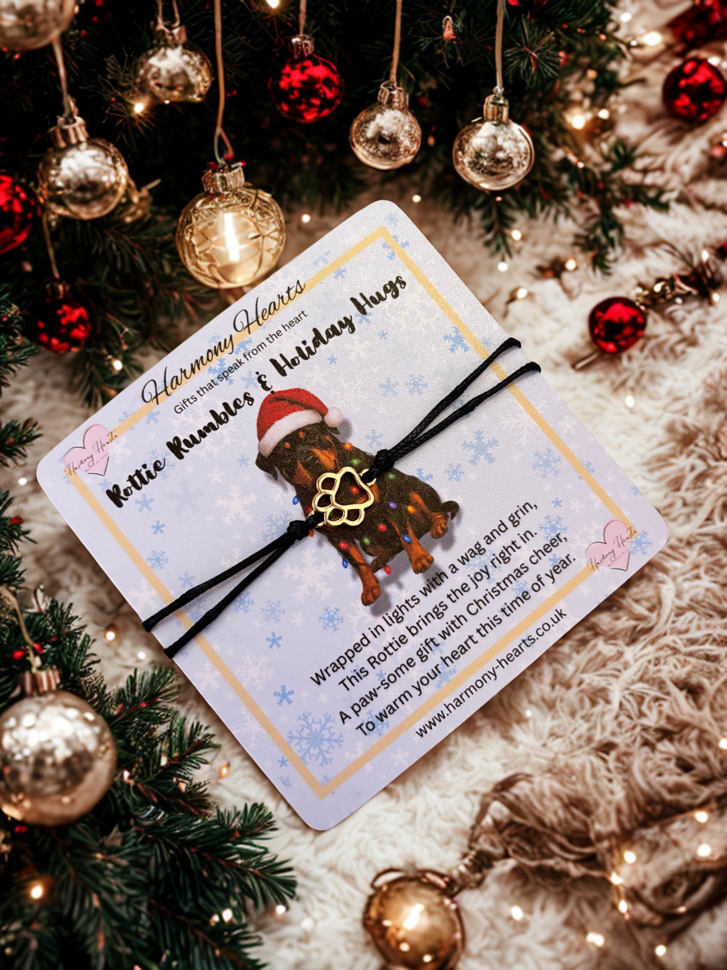 Rottie card with bracelet with paw print charm under a christmas tree