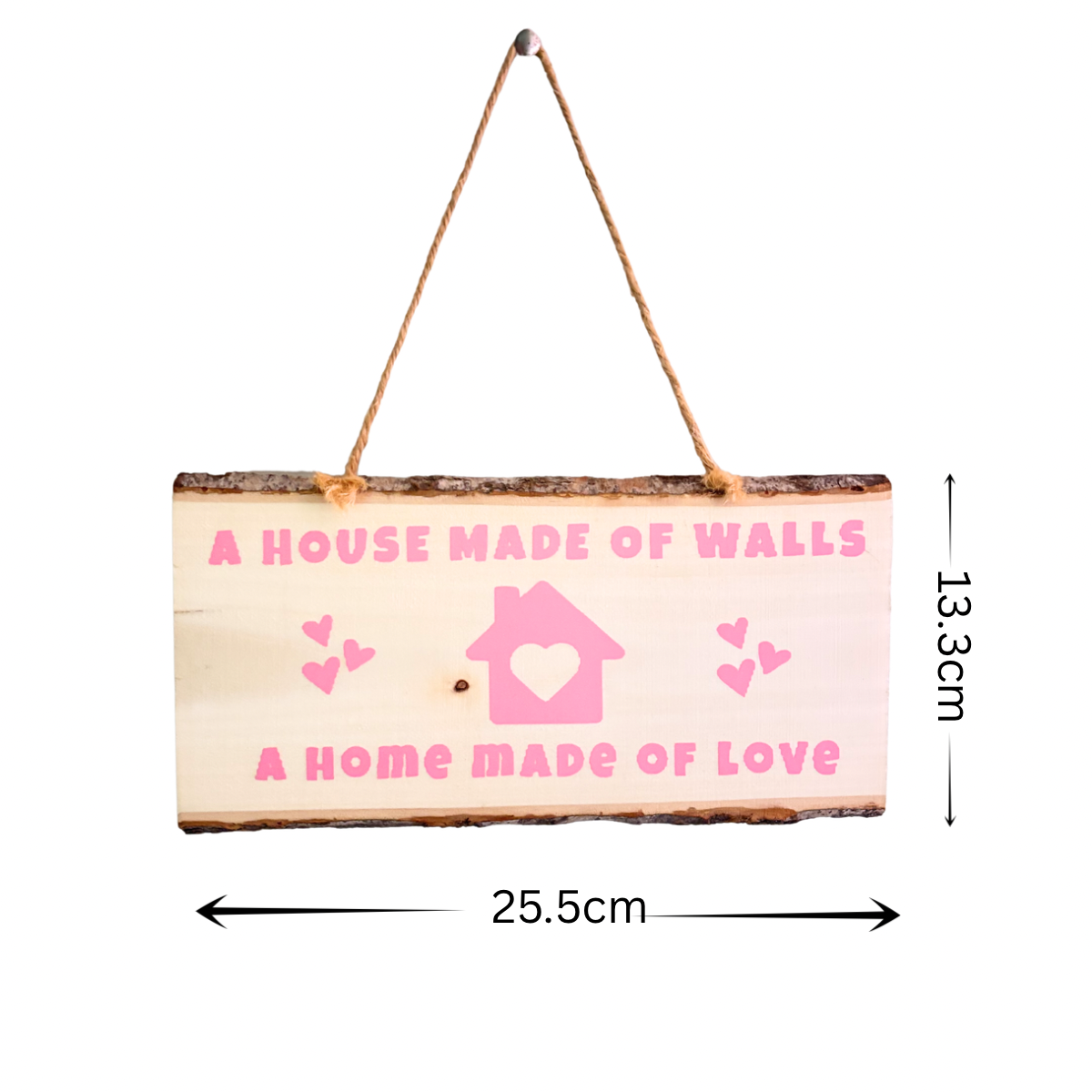 Rustic wooden plaque with the message, A house made of walls - A home made of love
