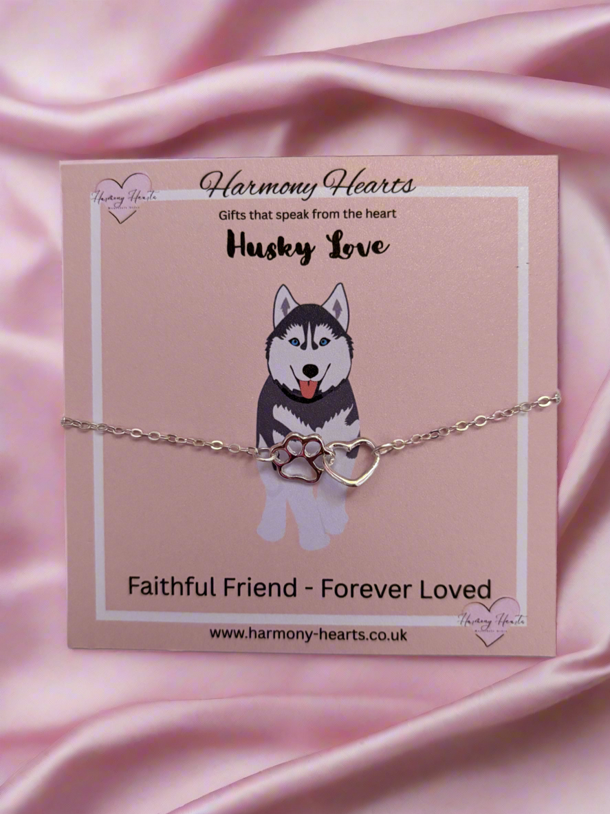 Bracelet with husky design on a pink satin background