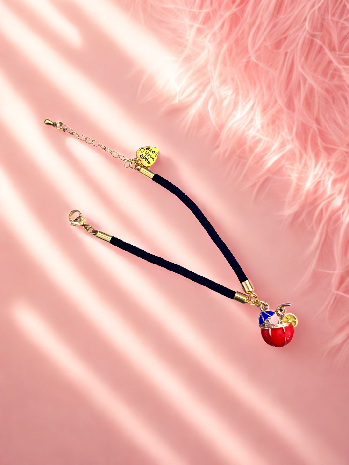 Black charm bracelet with cocktail charm