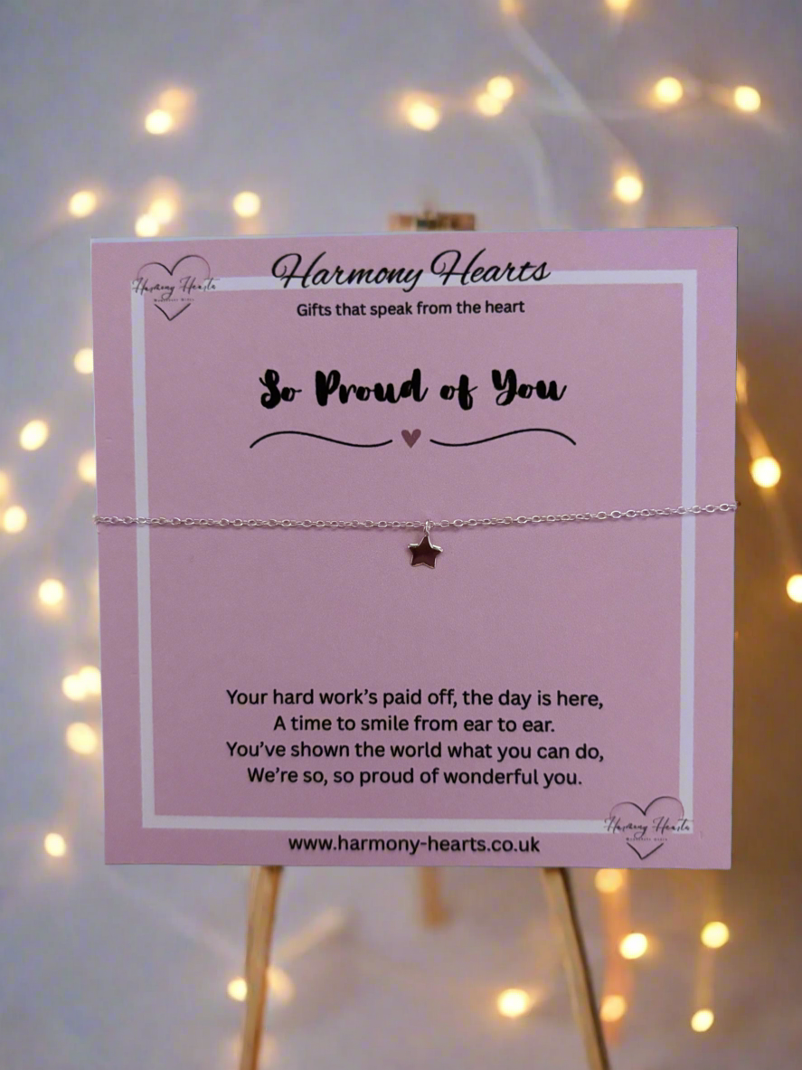 Star-shaped bracelet on a 'Harmony Hearts' card with glowing lights in the background