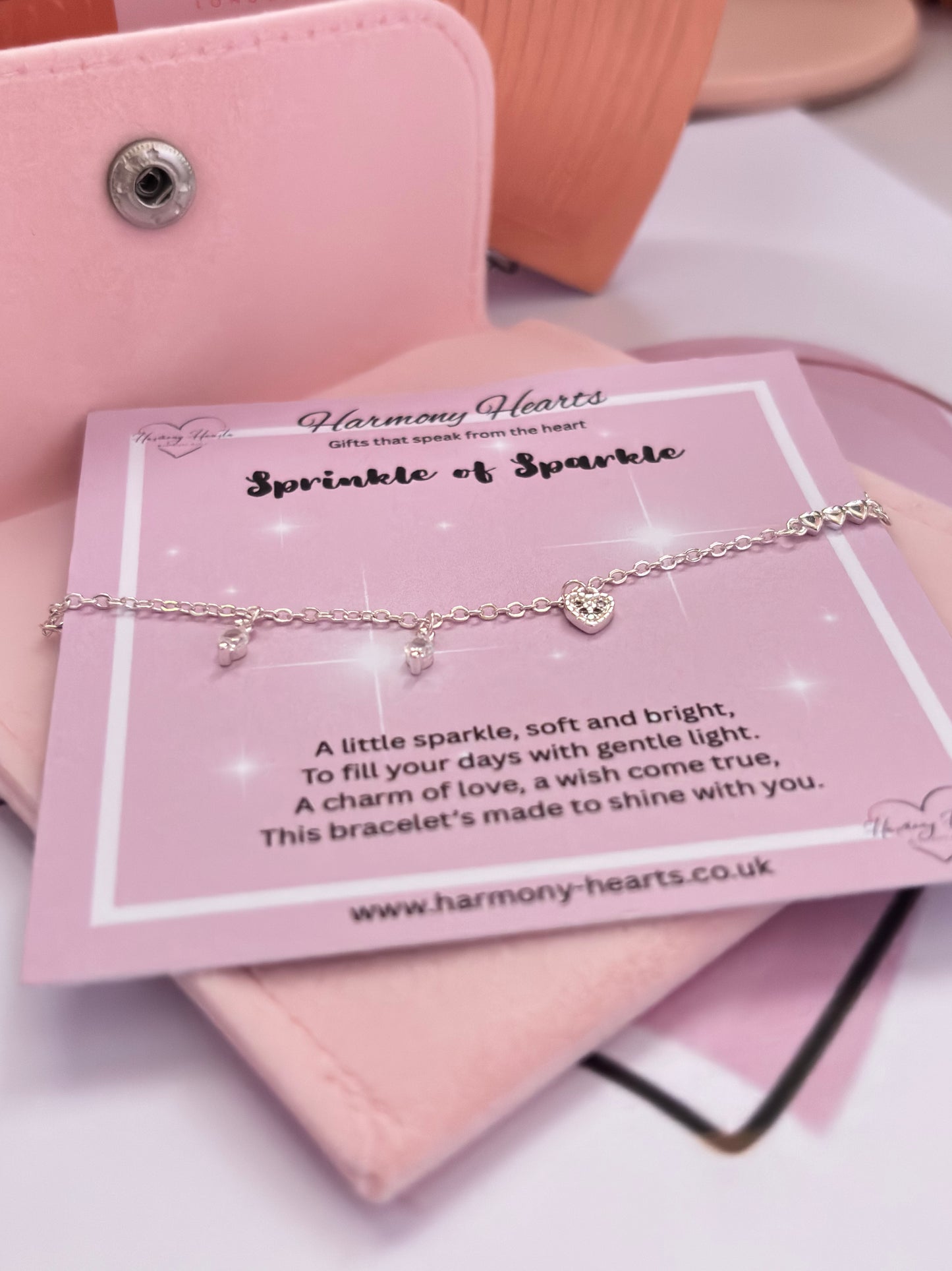Jewelry card with a bracelet on a pink surface