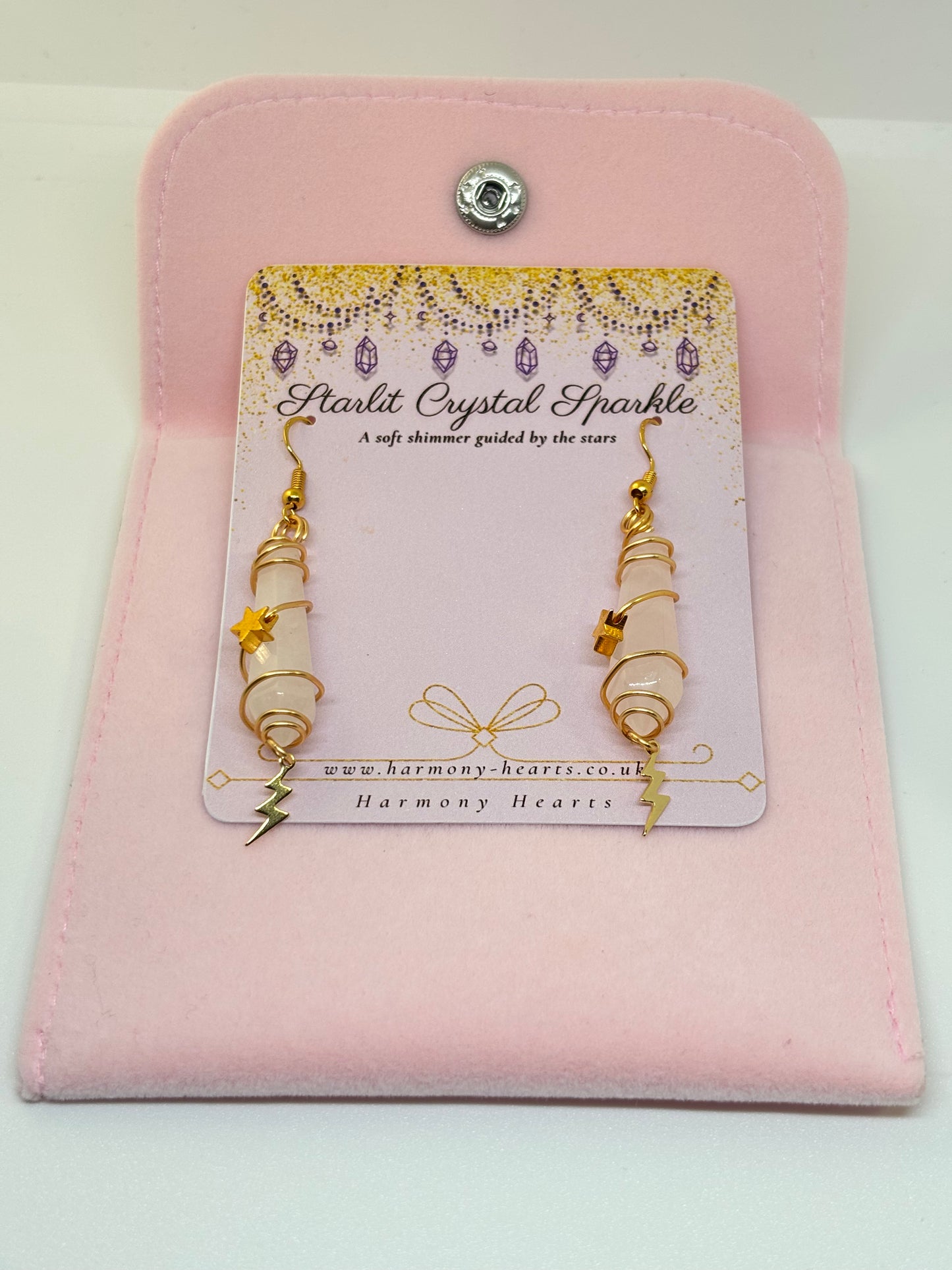 Pair of earrings on a 'Starlit Crystal Sparkle' card with a pink case.