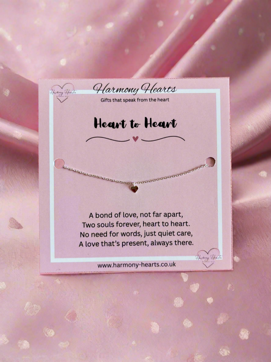 Bracelet on a 'Harmony Hearts' card with pink background
