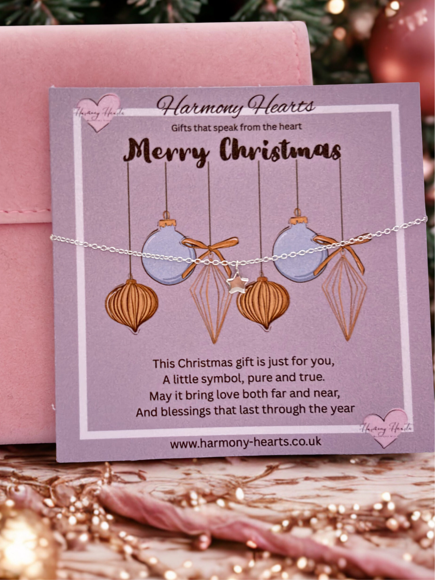 Jewelry card with Christmas ornaments on a pink background