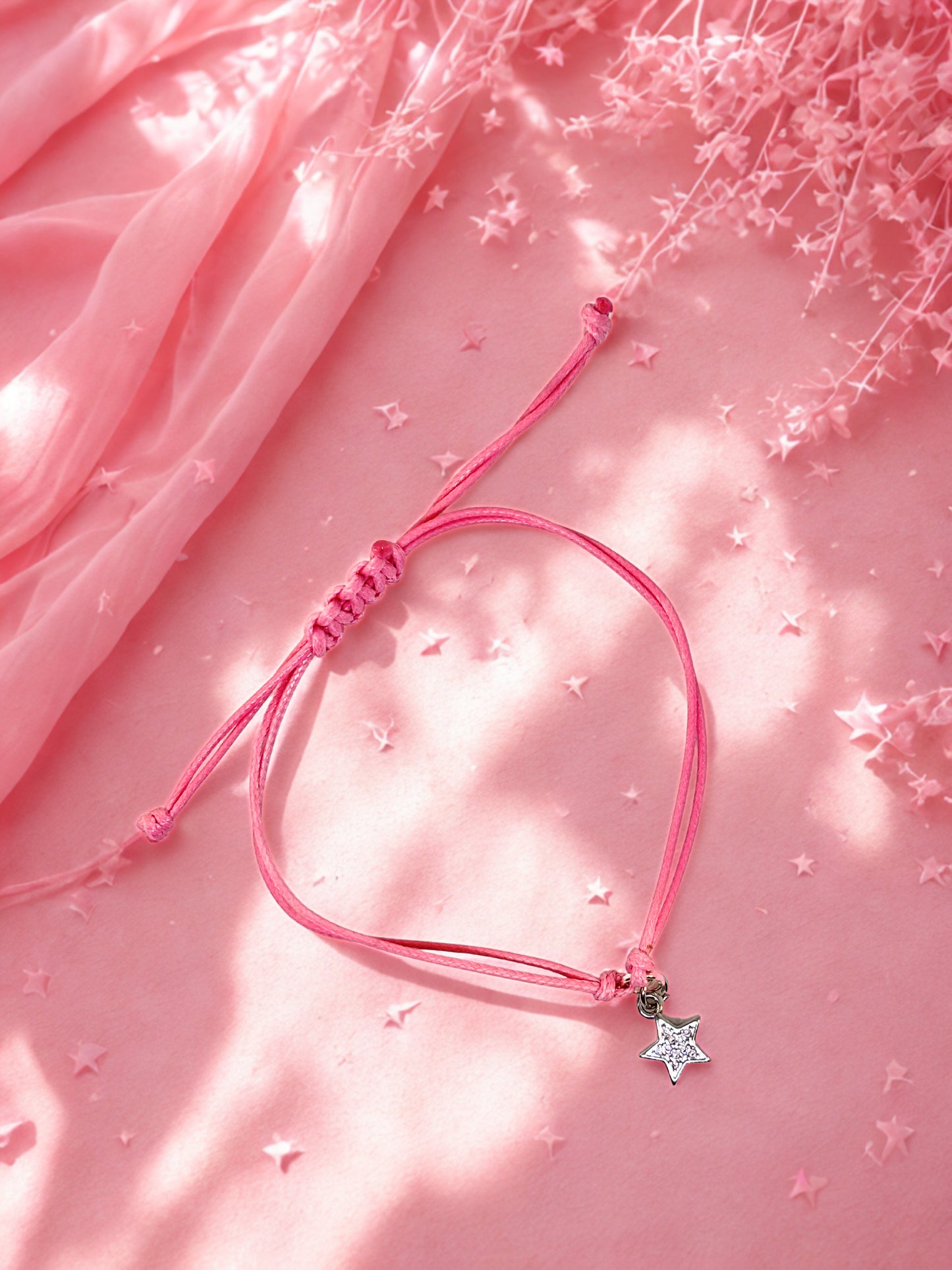 Pink cord bracelet with sparkly silver star charm
