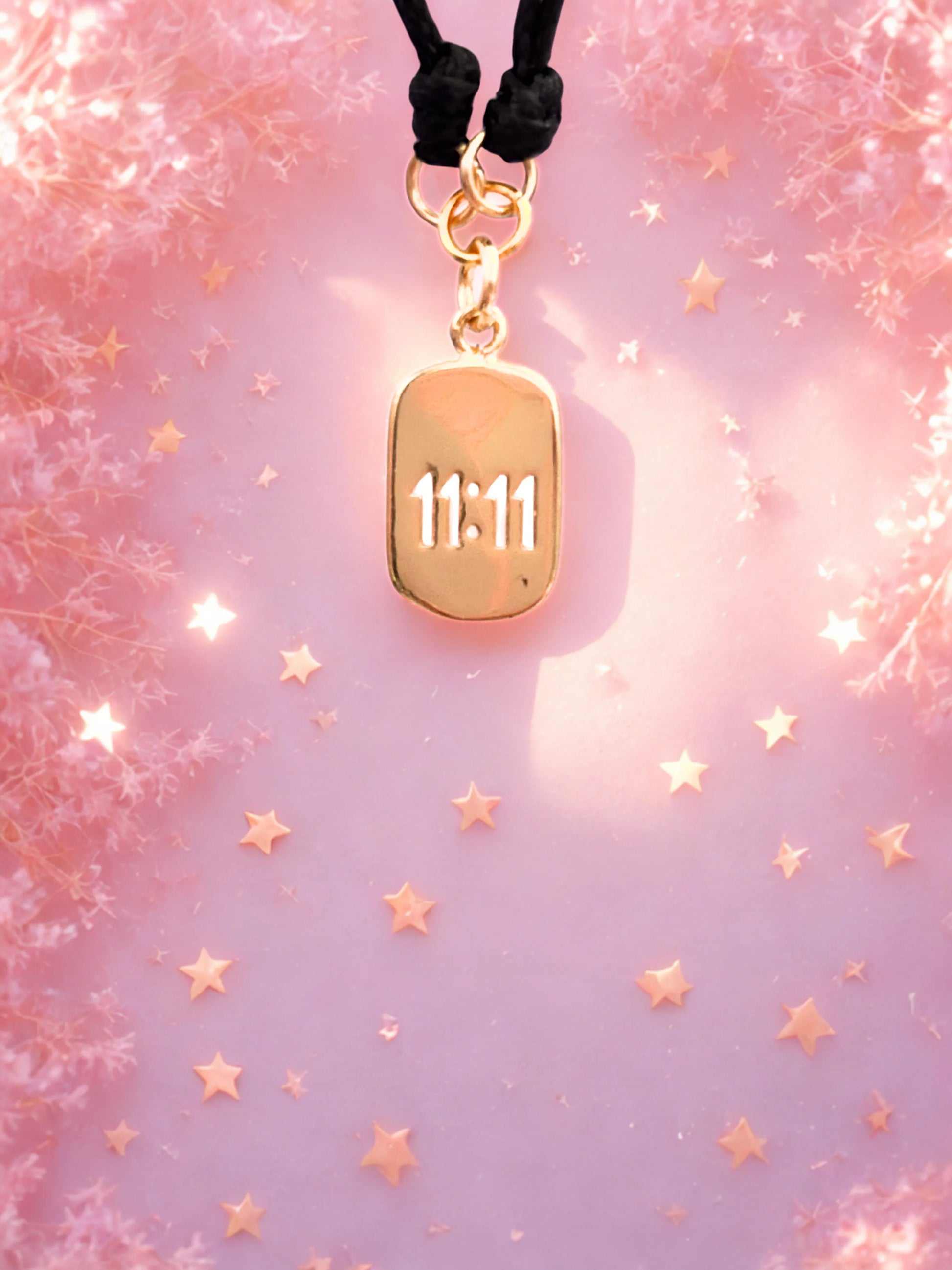 Gold 1111 charm on a black cord bracelet