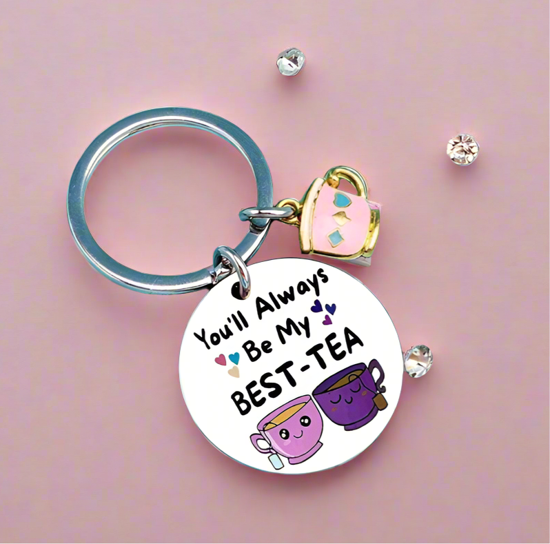 Keychain with 'You'll Always Be My Best-Tea' charm on a pink background