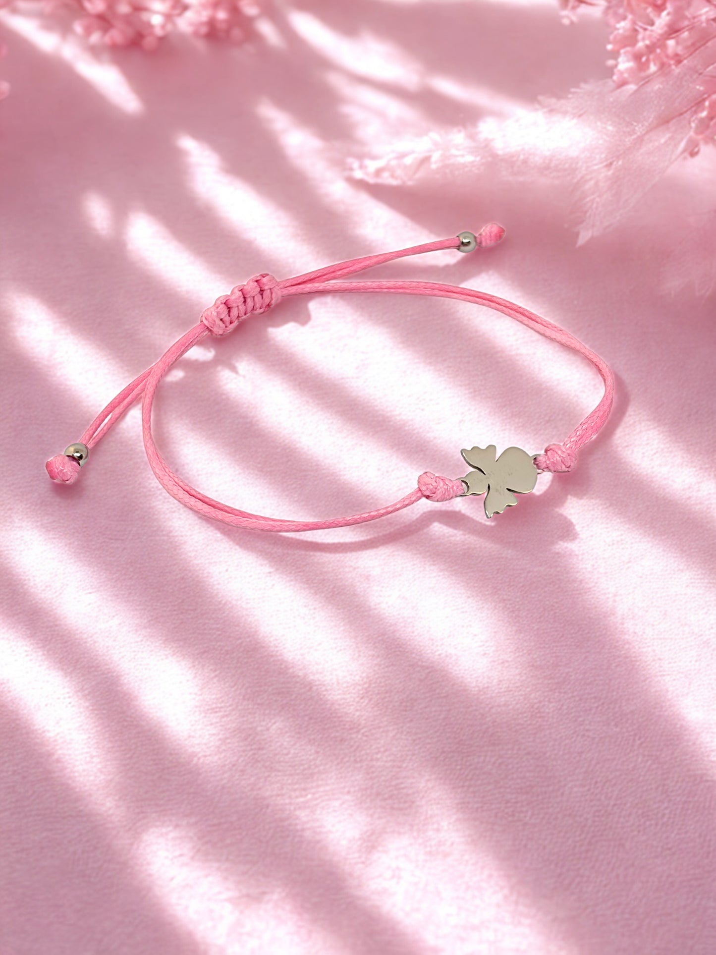 Pink cord bracelet with silver angel charm