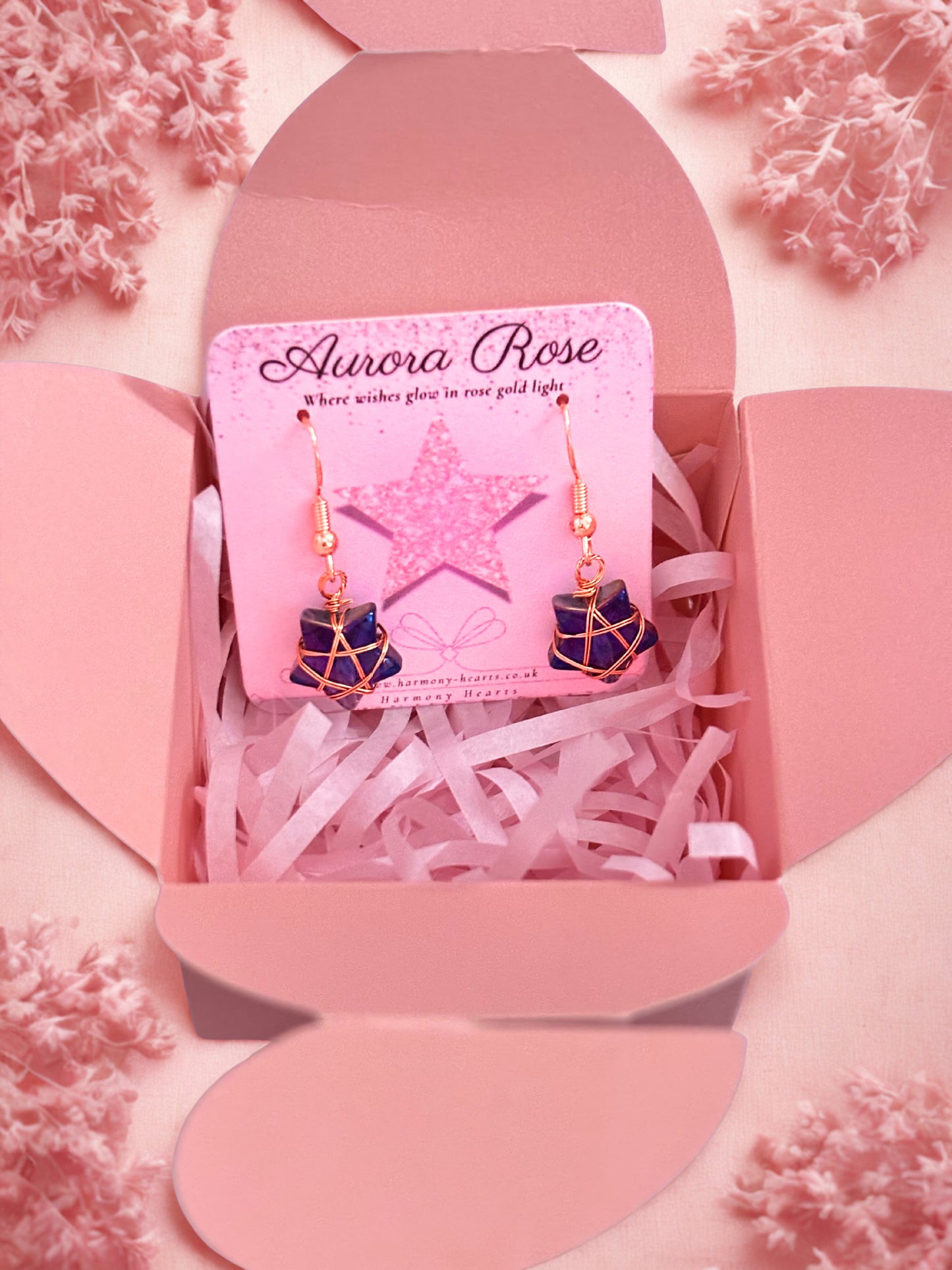 Earrings in a pink box with 'Aurora Rose' card