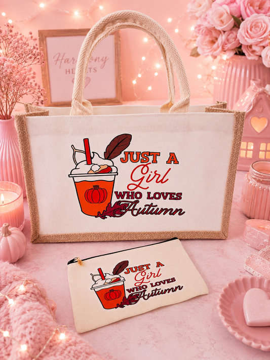 Tote bag and matching pouch with the words, Just a girl who loves autumn laid on a pink background