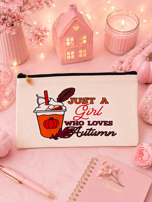 canvas pouch with the words, just a girl who loves autumn set on a pink background