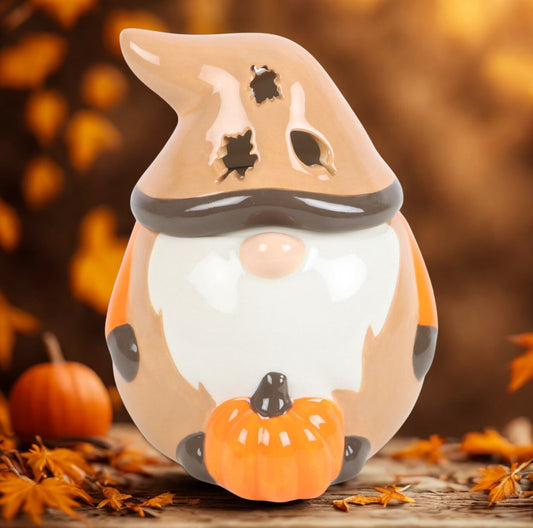 Gonk oil burner holding pumpkin