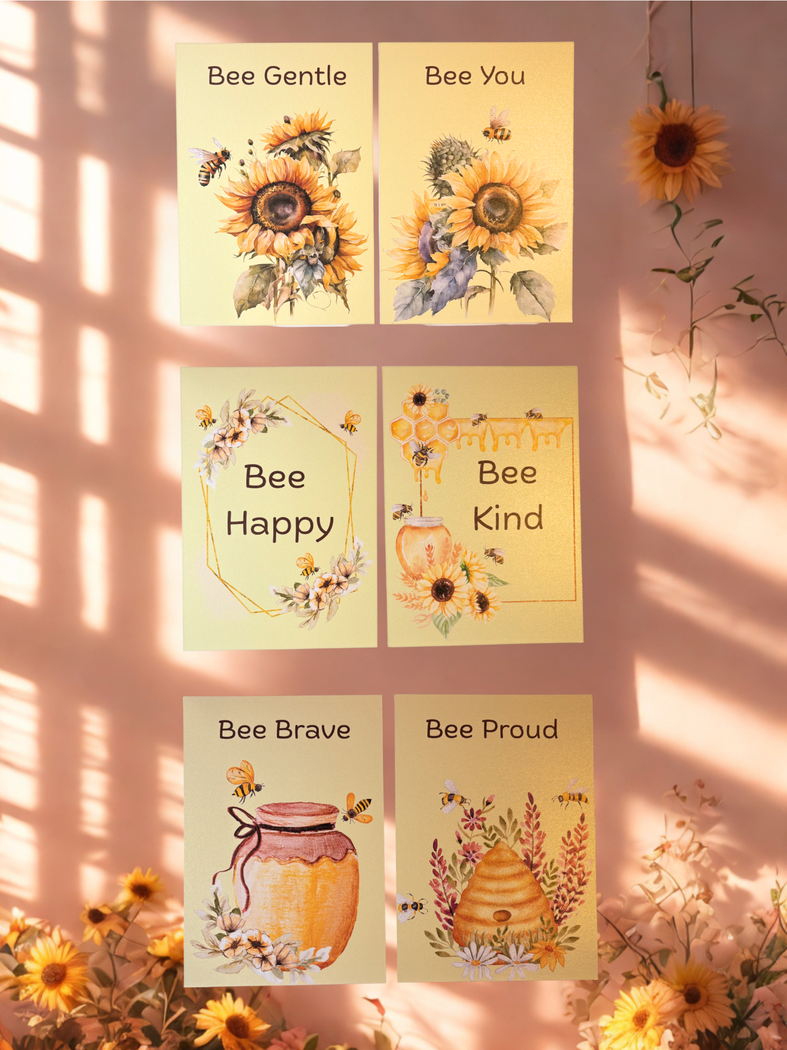 Set of motivational prints with sunflowers and bee-themed messages on a pink background.