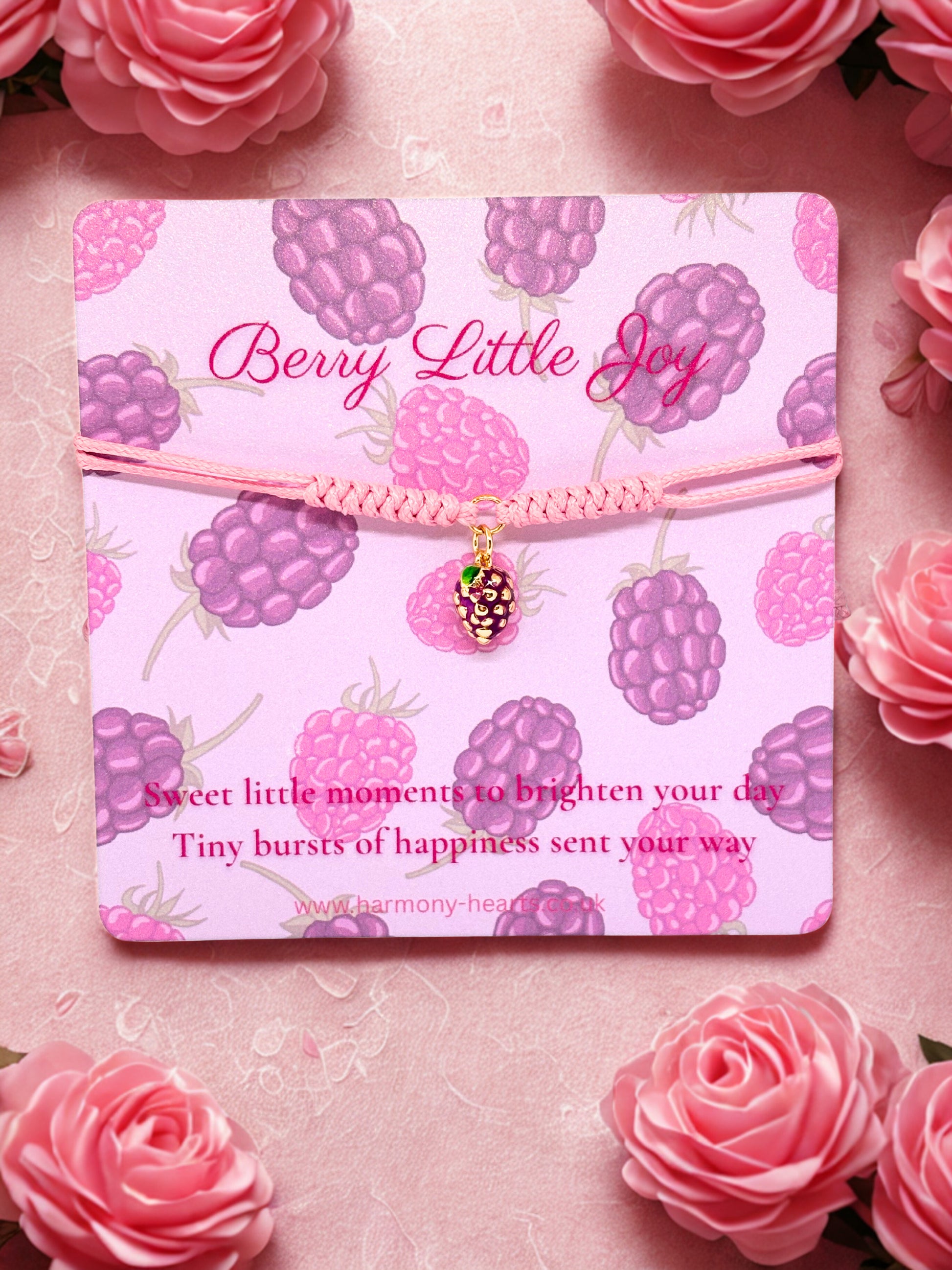 Pink cord bracelet with a blackberry charm presented on a Harmony Hearts branded poem card