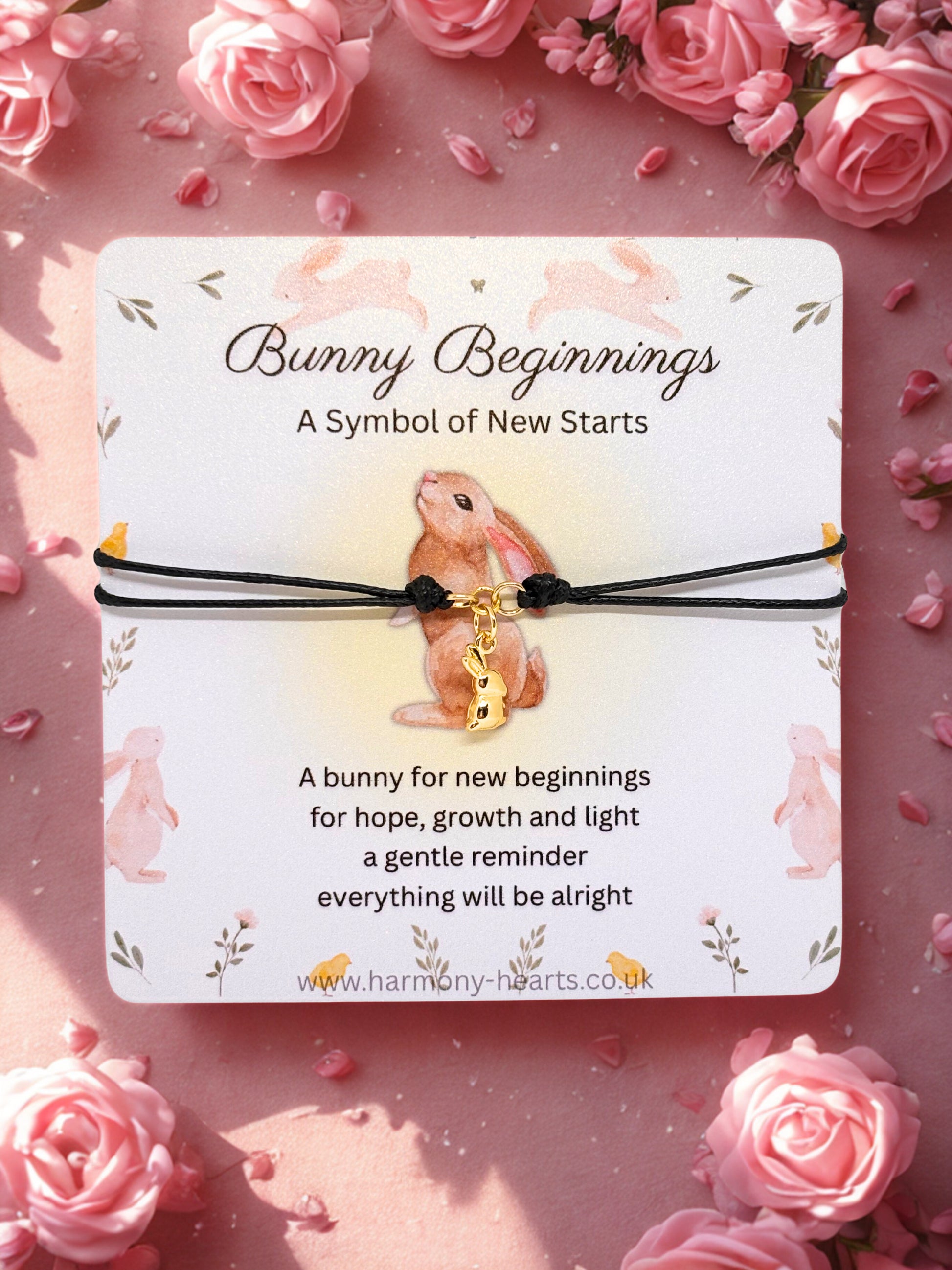 Bunny-themed bracelet on a card with floral background