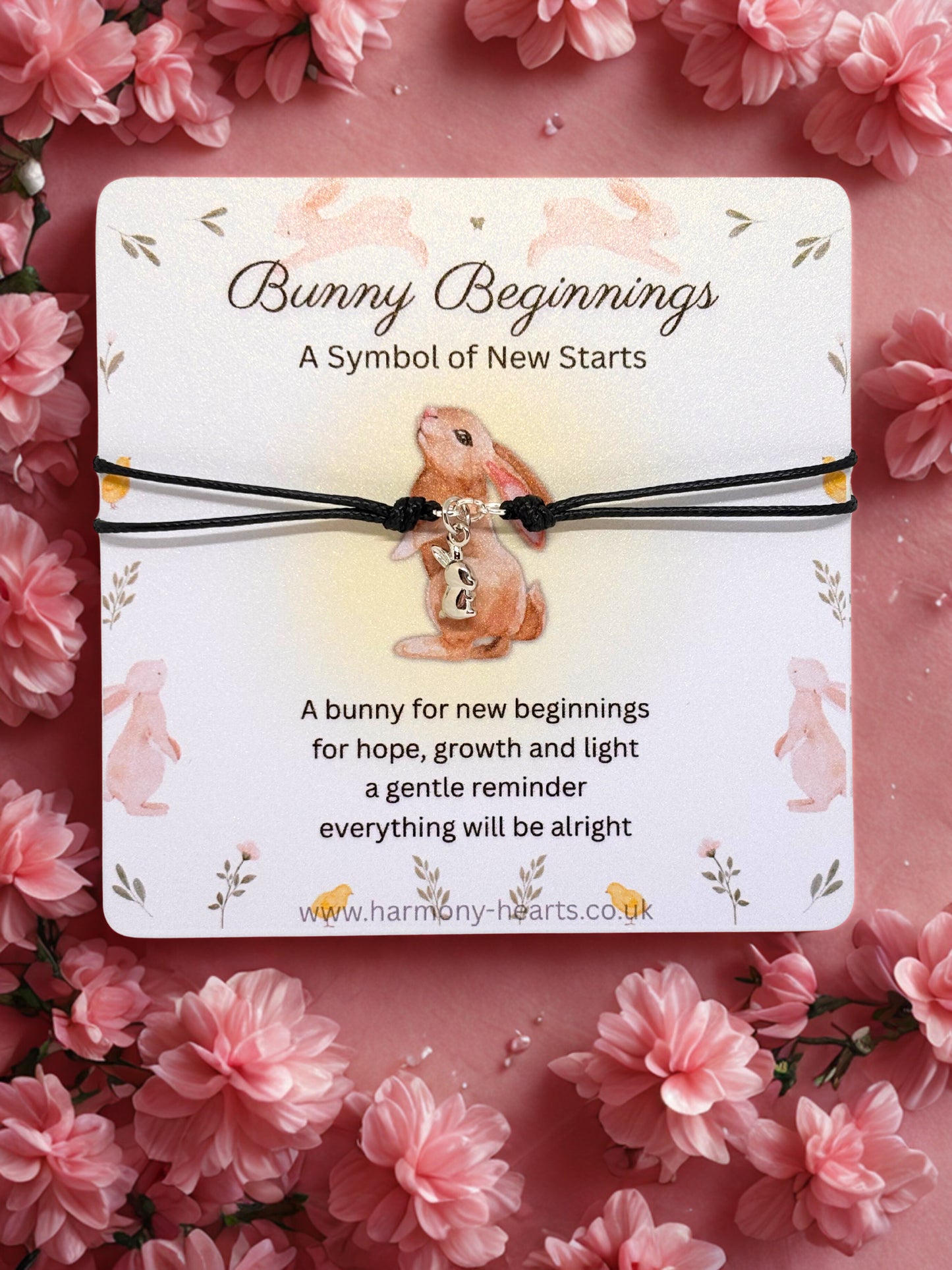 Bunny bracelet on a card with floral background