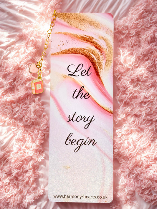Bookmark with 'Let the story begin' text on a pink and gold background