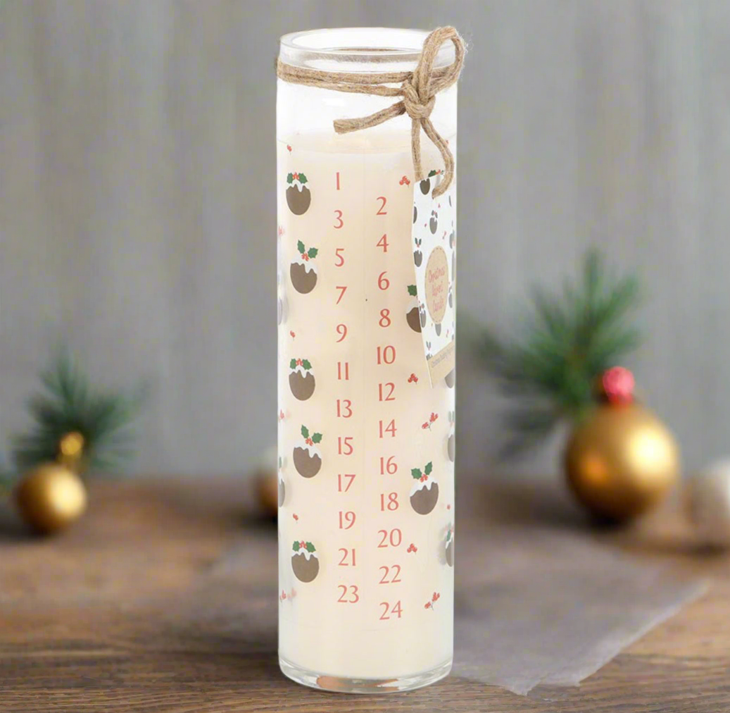 Candle with a countdown pattern on a wooden surface with decorative elements.
