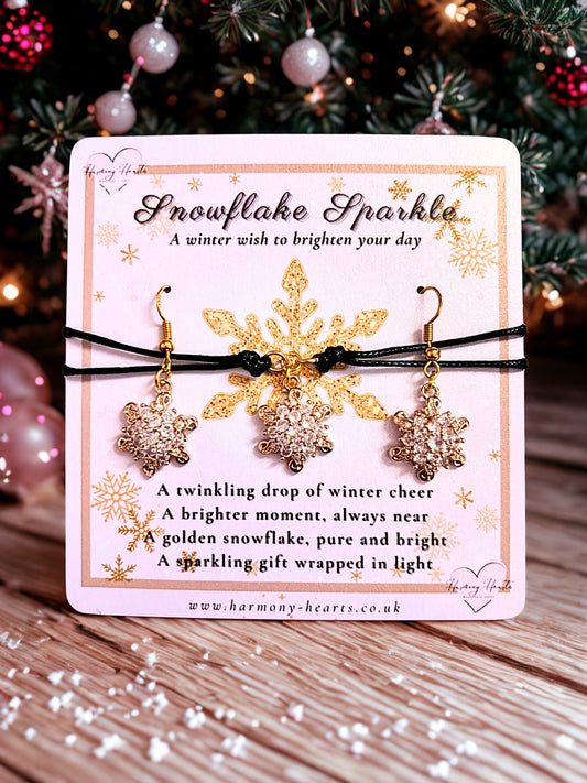 Snowflake earrings and a bracelet on a decorative card with Christmas tree in the background
