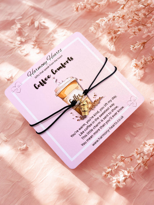 Coffee cup charm bracelet on a card with coffee design and text on a pink floral background
