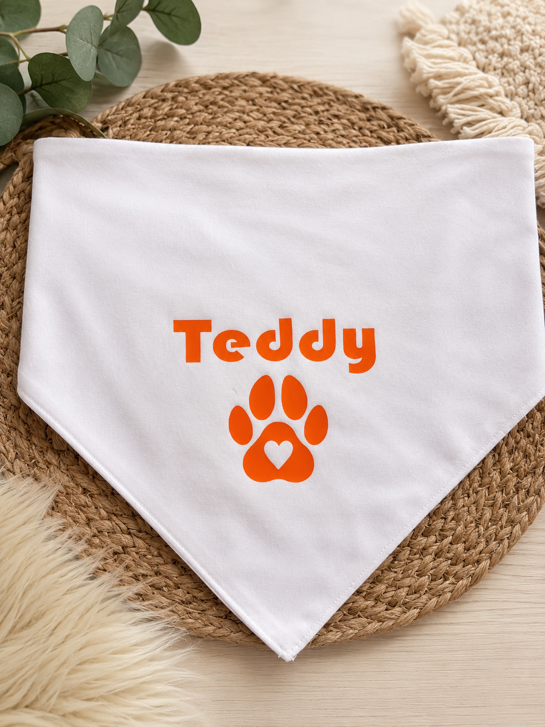 White Bandana with the name Teddy in orange and a paw print