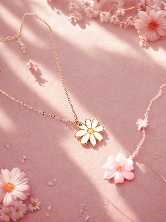 Necklace with a daisy pendant on a pink background with flowers