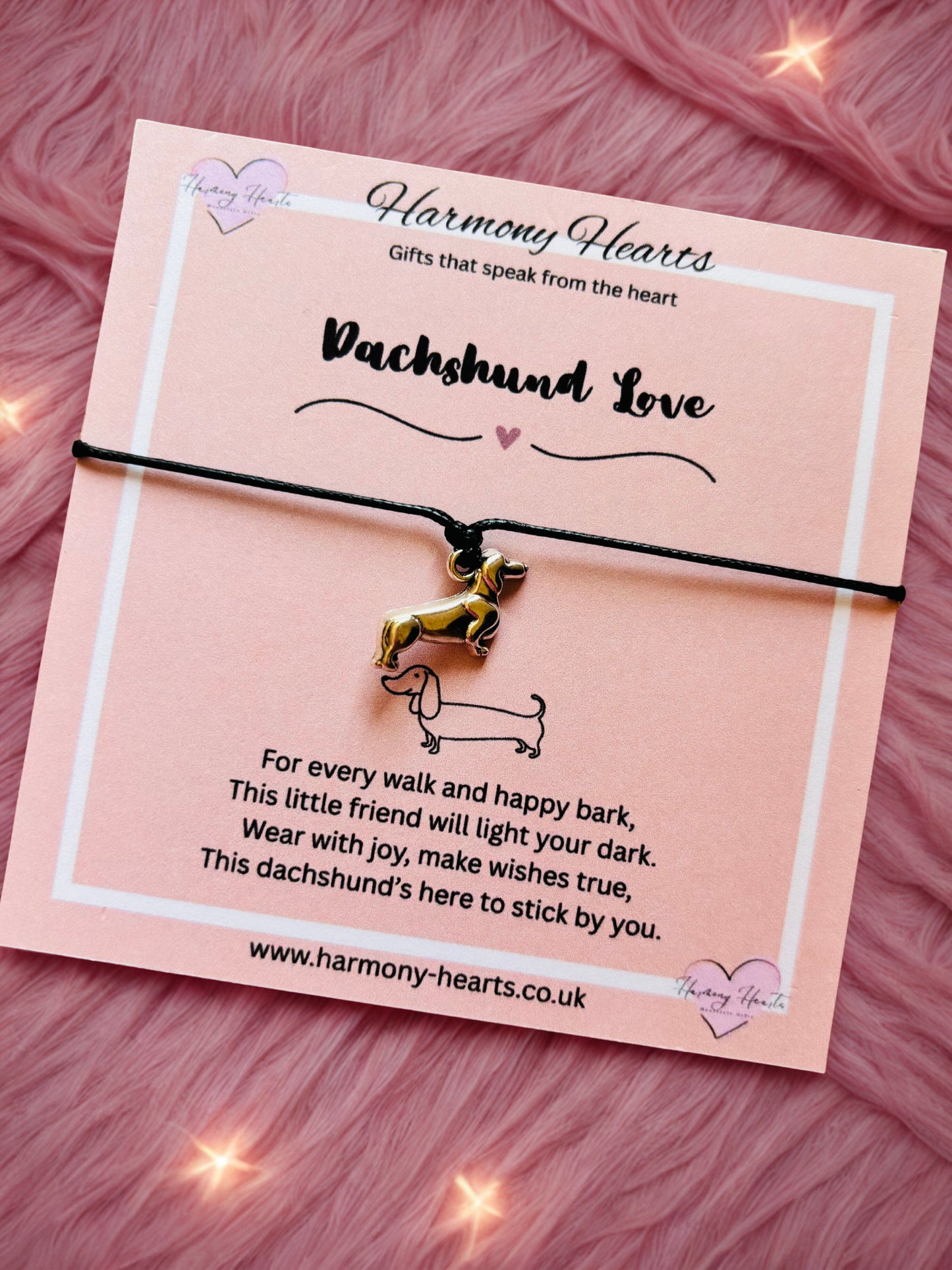 Bracelet with dachshund charm on a pink card from Harmony Hearts