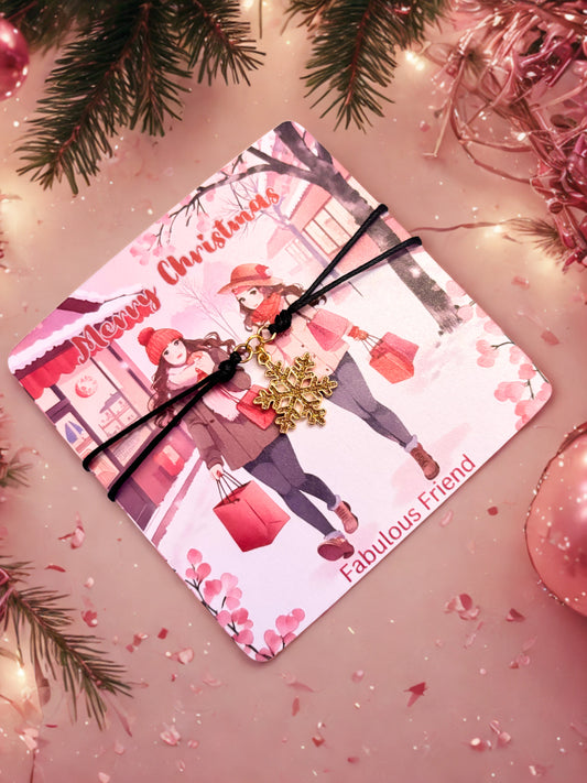 Gold snowflake bracelet presented on a Pink Christmas card with festive design and decorative elements on a pink background.
