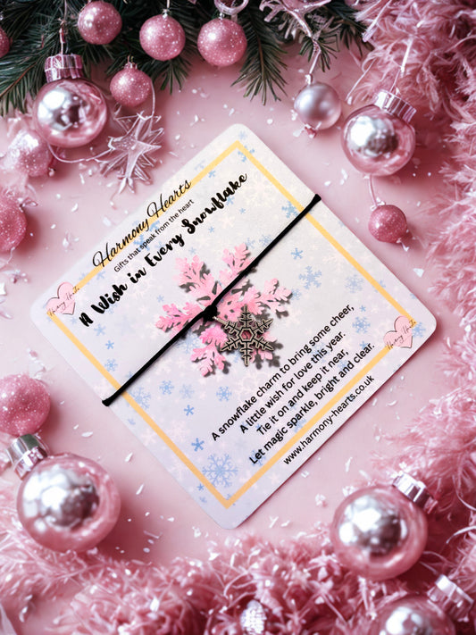 Silver-tone snowflake on a black cord bracelet with poem card on a festive background